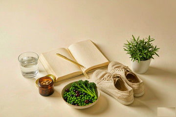 Wellness reset: habit journal, gold pen, water glass, amber supplement jar, walking shoes.